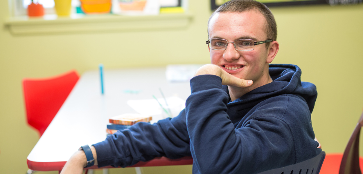 Man smiling in classroom