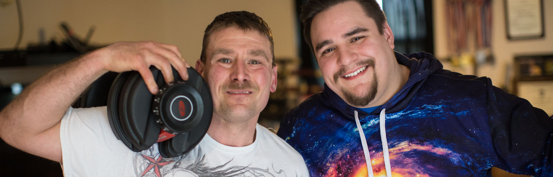 Friends Smiling, with dumbbell over shoulder