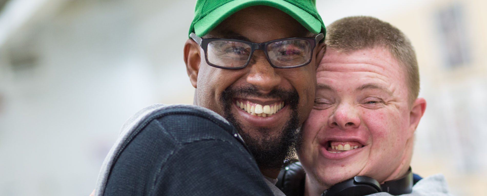 Friends smiling and embracing