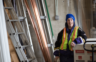 Man Smiling at a Worksite