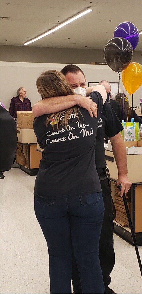 Two adults hugging