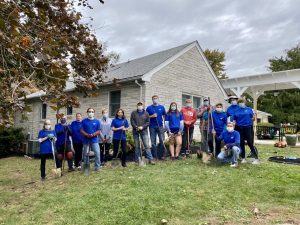 Volunteers Posing For Photo in Yard