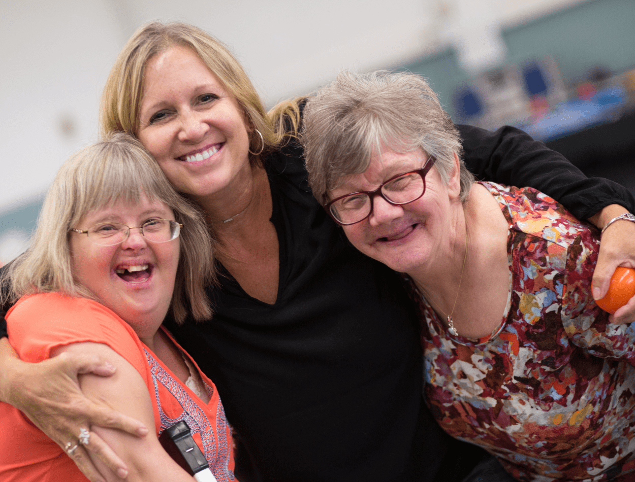 Three women smiling