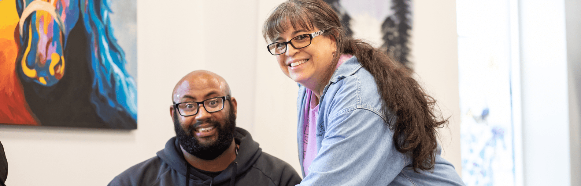 Man and woman smiling at the day program