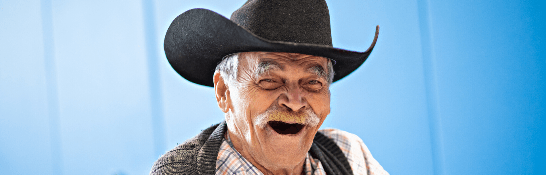 Man in cowboy hat smiling