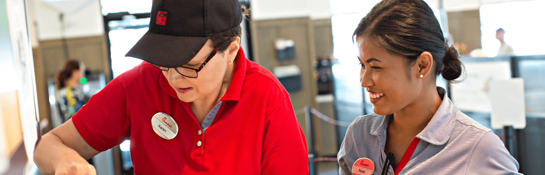 Two women working at a fast food establishment