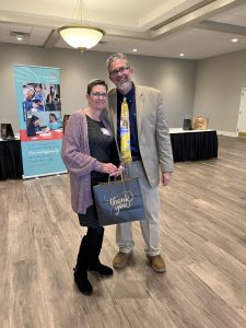 DSP Diane & CEO Greg smiling at awards ceremony