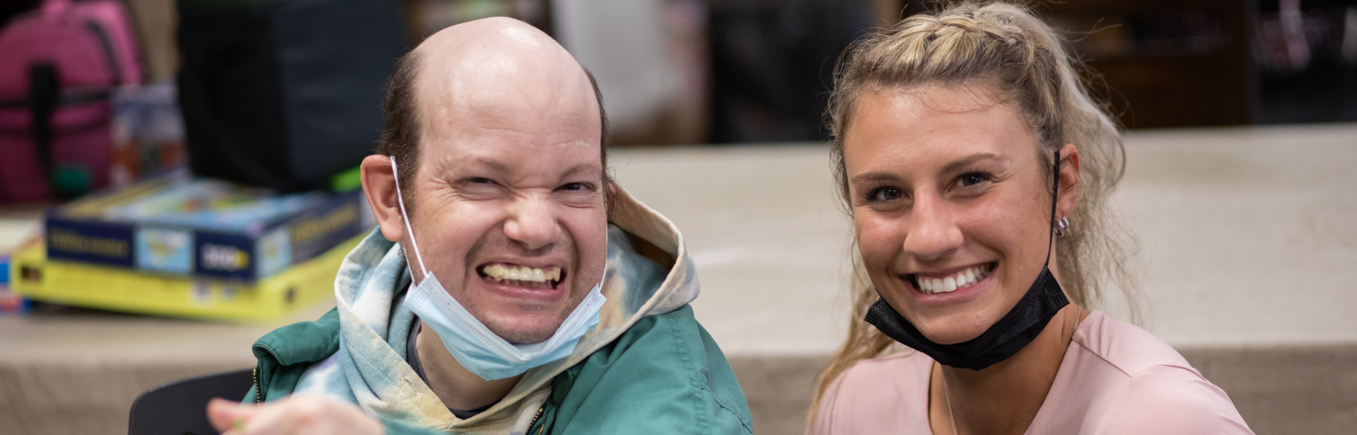 A man and woman smiling.