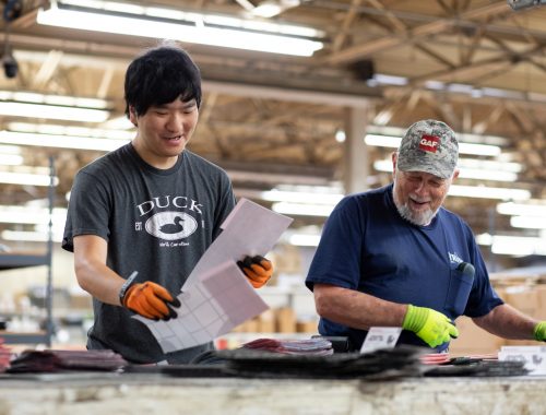 Two men working in a warehouse