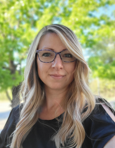 Headshot of Courtney smiling.