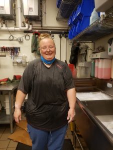 A woman standing in an office.