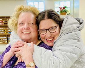 Melanie hugging Joann.