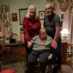 Doris poses for a photo with her husband and sister, Janie.