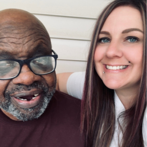 Kristen Brookshire takes a selfie with a person she supports.