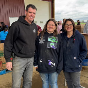 Ben and Carissa Mortenson stand beside their daughter, Morgan, at the farm.