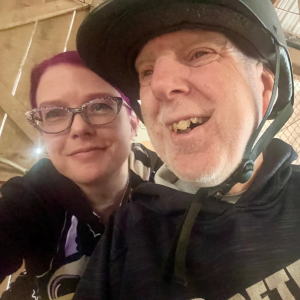Kimberly Palmer and Tommy take a selfie at Taking the Lead, where Tommy goes horseback riding. Tommy is wearing a helmet.