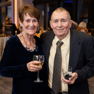 Jill Golueke and her husband pose together at the 2025 Gala. 
