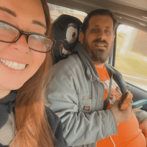 Betty takes a selfie with a person she supports.