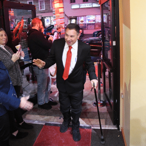 Dave waves to a crowd of supporters and "paparazzi" as he walks in from the limo on the red carpet.