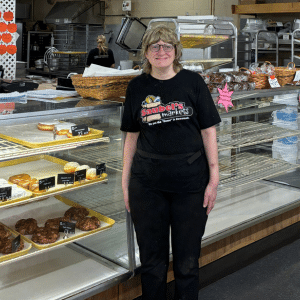 Cindy Rohrbaugh poses at one of her part-time jobs, working at Saubel's Bakery in Shrewsbury.