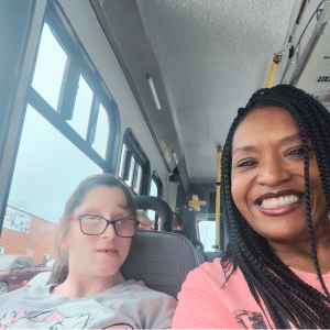 Daniella Amos and a person supported take a selfie