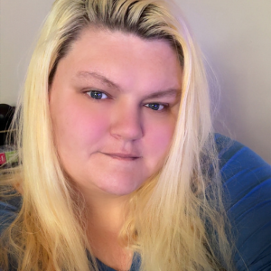 A selfie of Crystal Rich with a white background.