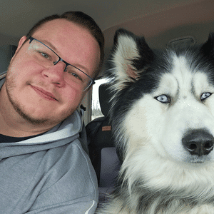 Garret Serio takes a selfie with a dog